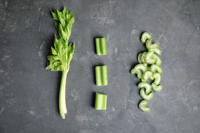 Photo of Flat lay composition with celery on grey table