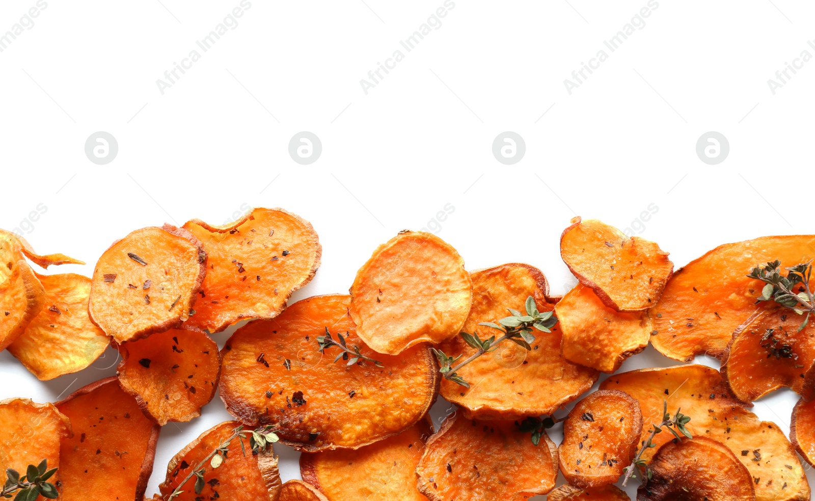 Photo of Sweet potato chips with herbs on white background, top view