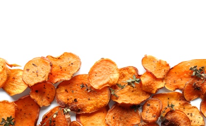 Sweet potato chips with herbs on white background, top view