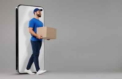 Image of Courier with parcel walking out from huge smartphone on grey background. Delivery service. Space for text
