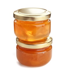 Two jars with tasty sweet jam on white background
