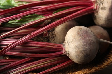 Raw ripe beets in wicker bowl, closeup