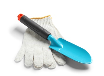 Photo of New trowel and gloves on white background. Professional gardening tools