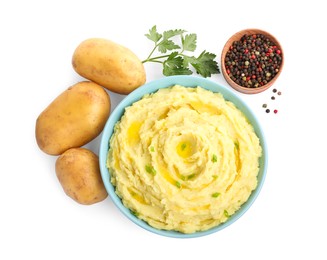 Photo of Bowl of tasty mashed potatoes with ingredients on white background, top view