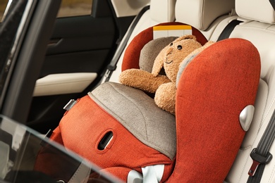 Photo of Safety seat for baby with cute toy rabbit