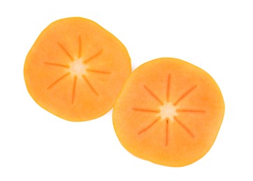 Photo of Halves of delicious ripe juicy persimmons on white background, top view