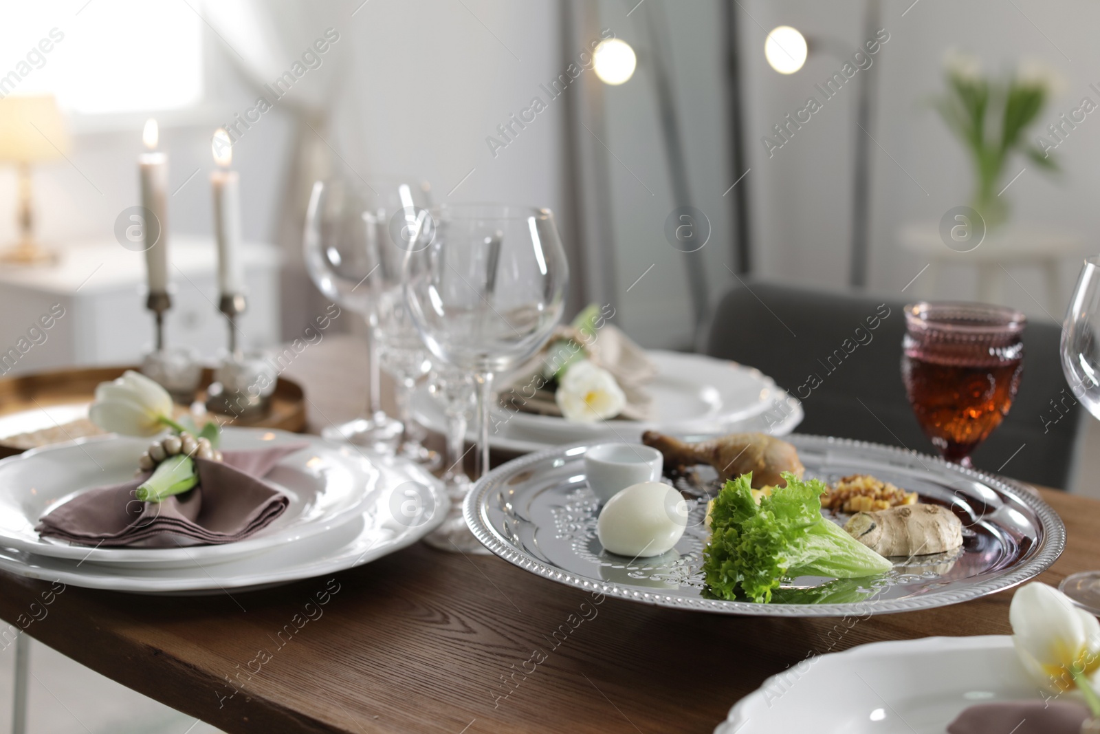 Photo of Festive Passover table setting at home. Pesach celebration