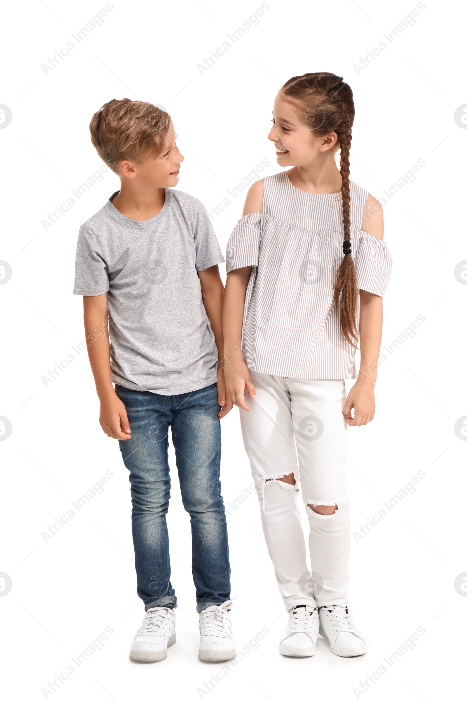 Photo of Cute little children on white background. Happy family