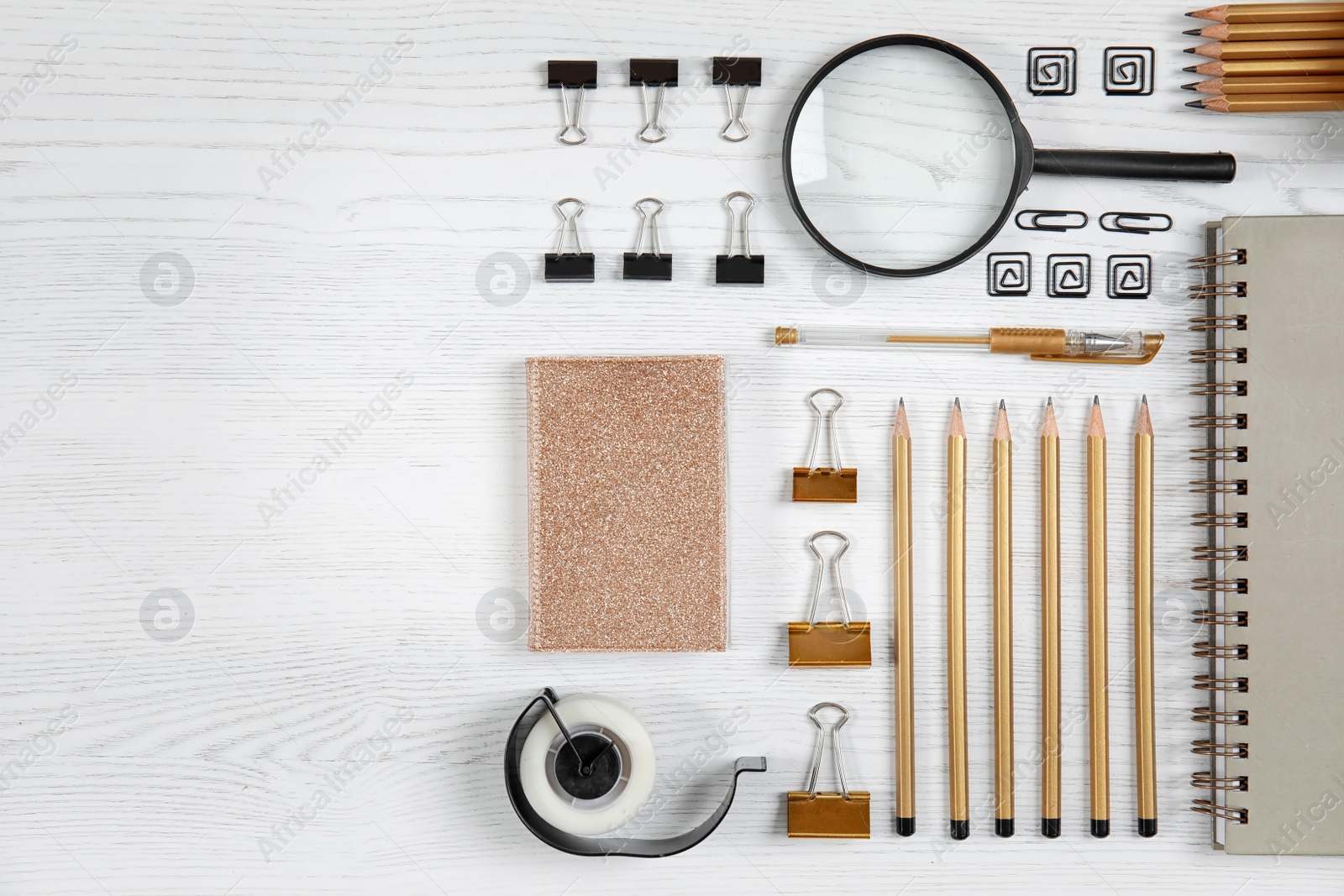 Photo of Different school stationery with space for design on wooden background, flat lay