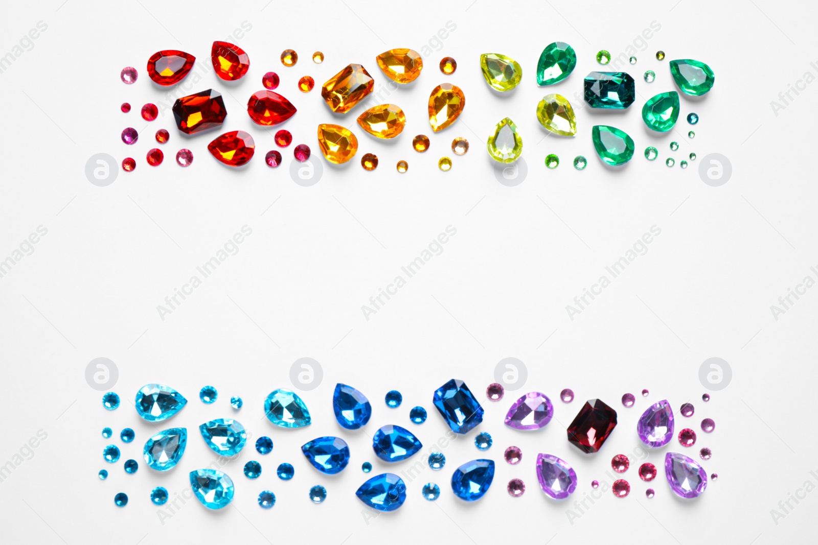 Photo of Different beautiful gemstones on white background, top view