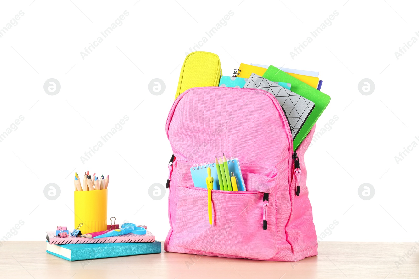 Photo of Color backpack with stationery on white background. Ready for school