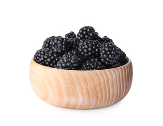 Photo of Fresh ripe blackberries in wooden bowl isolated on white