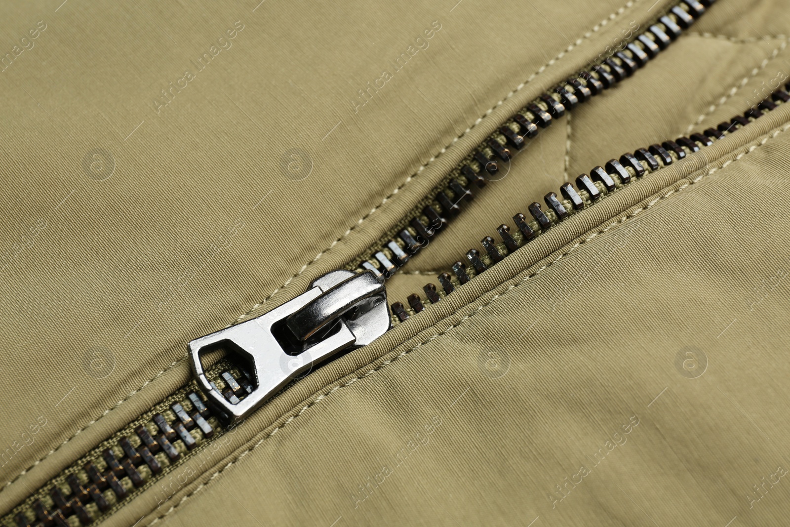 Photo of Grey jacket with zipper as background, closeup view