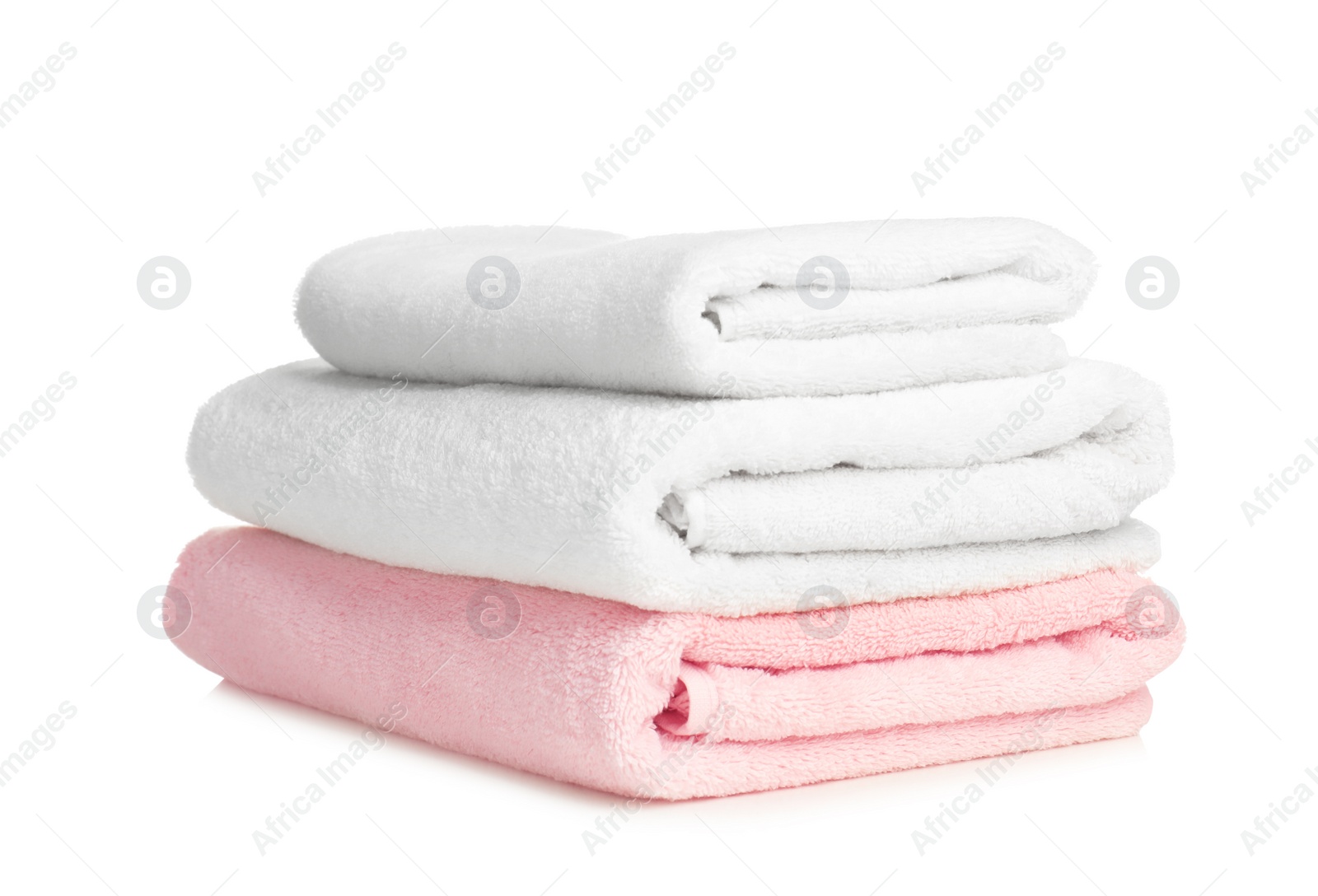 Photo of Folded soft terry towels on white background