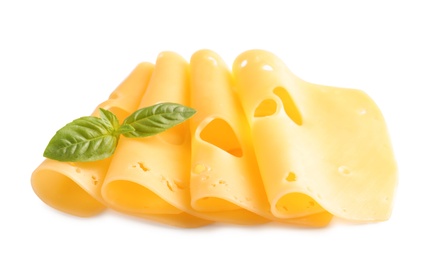 Slices of tasty maasdam cheese with basil on white background
