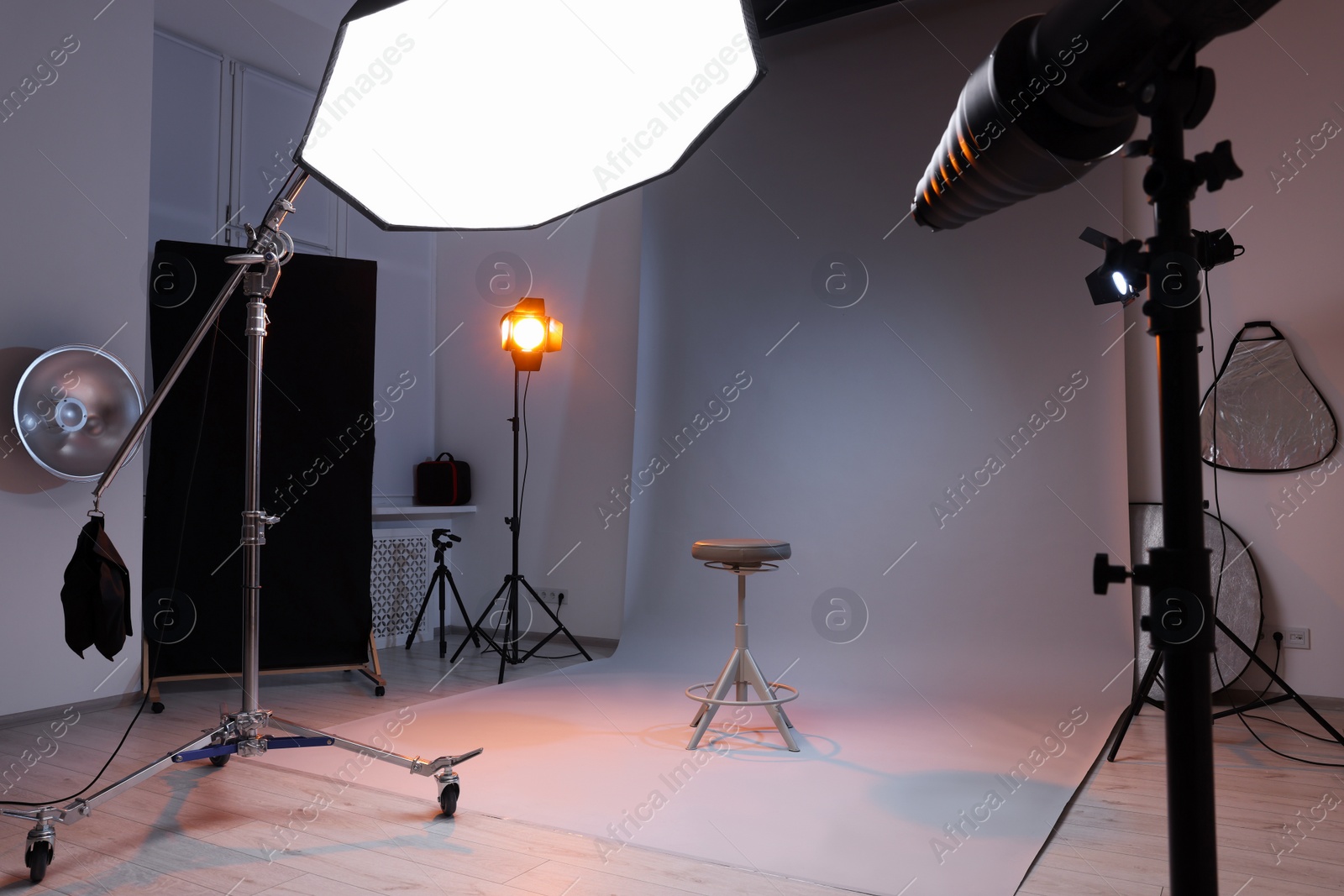 Photo of Casting call. Chair and different equipment in modern studio