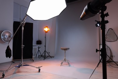 Casting call. Chair and different equipment in modern studio