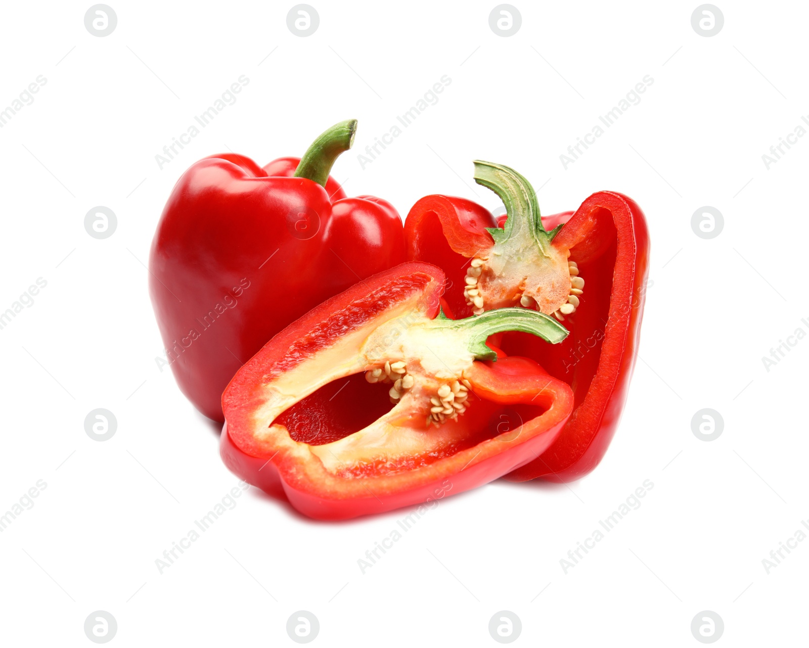 Photo of Whole and cut red bell peppers on white background