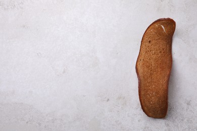 Crispy rusk on light table, top view. Space for text