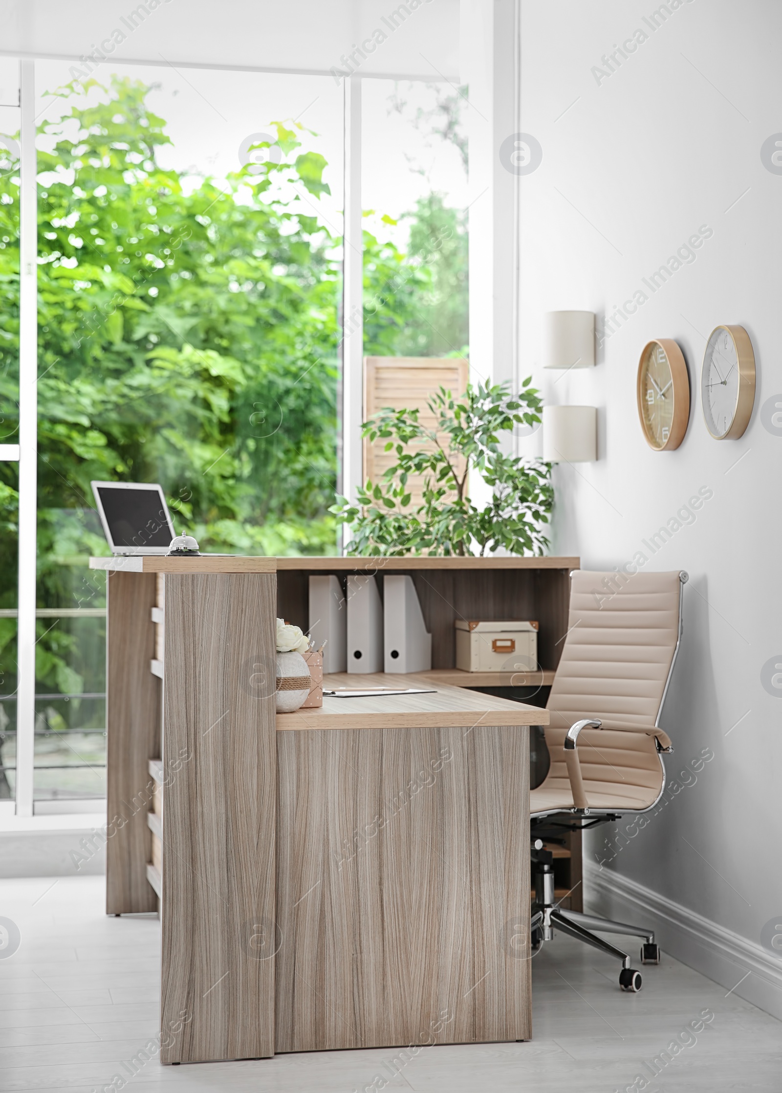 Photo of Receptionist desk in hotel. Workplace interior