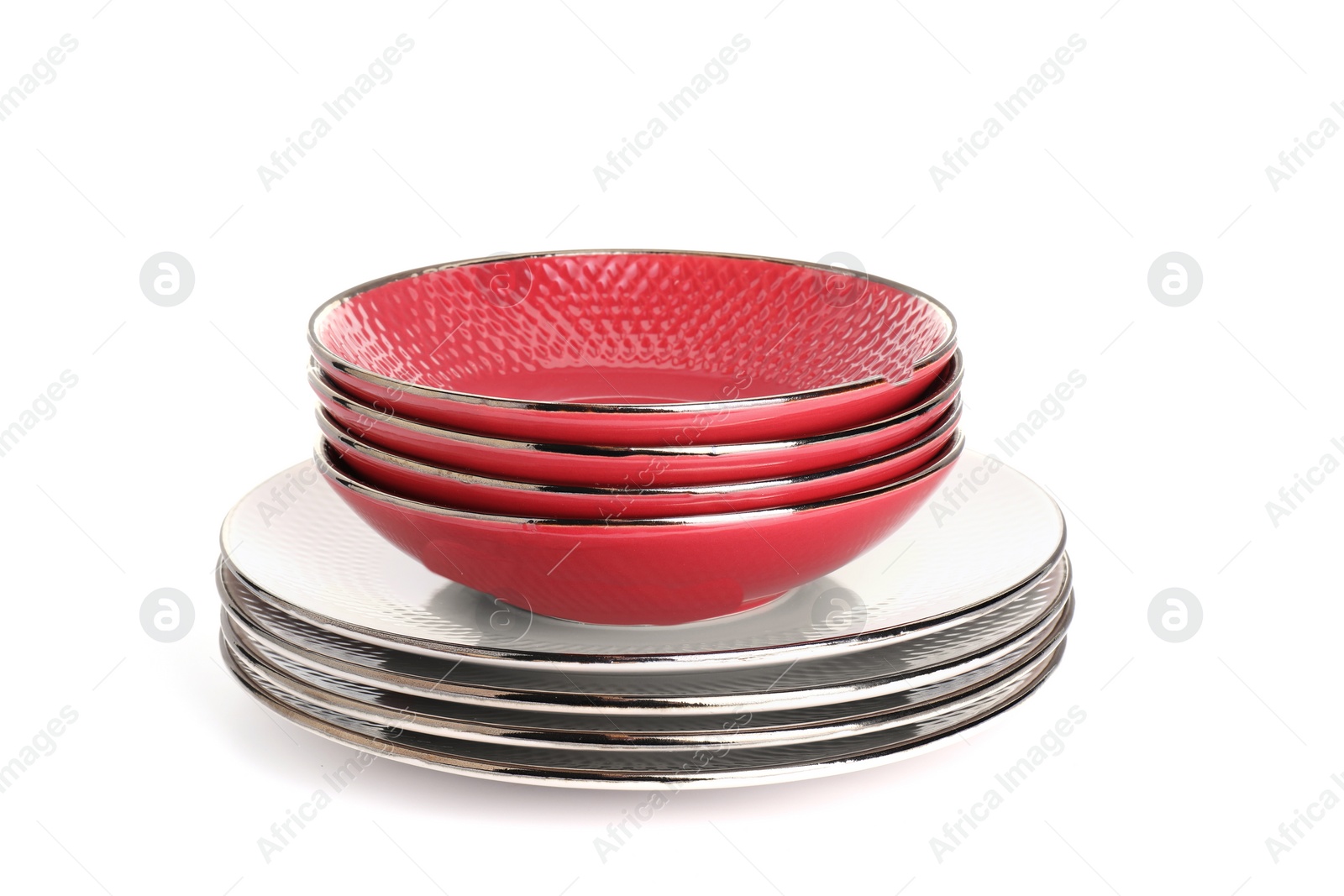 Photo of Stack of beautiful ceramic plates and bowls isolated on white