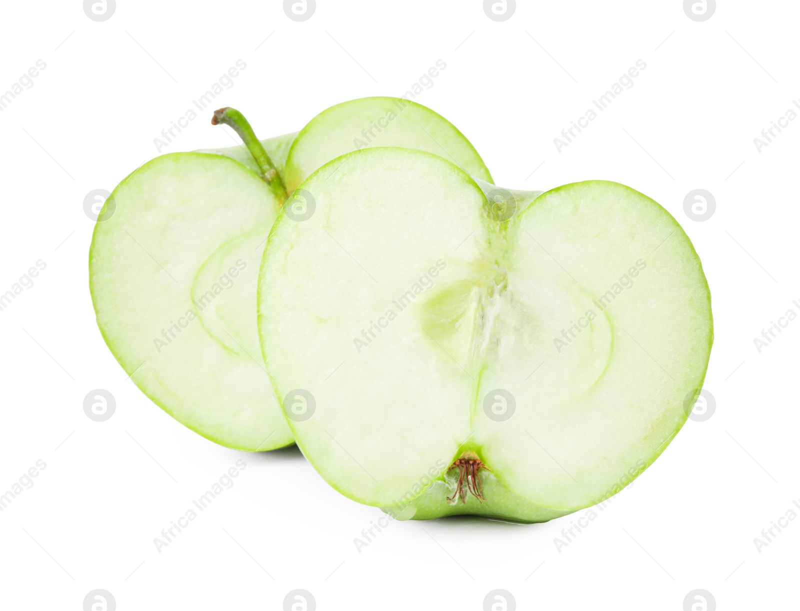 Photo of Halves of ripe green apple on white background