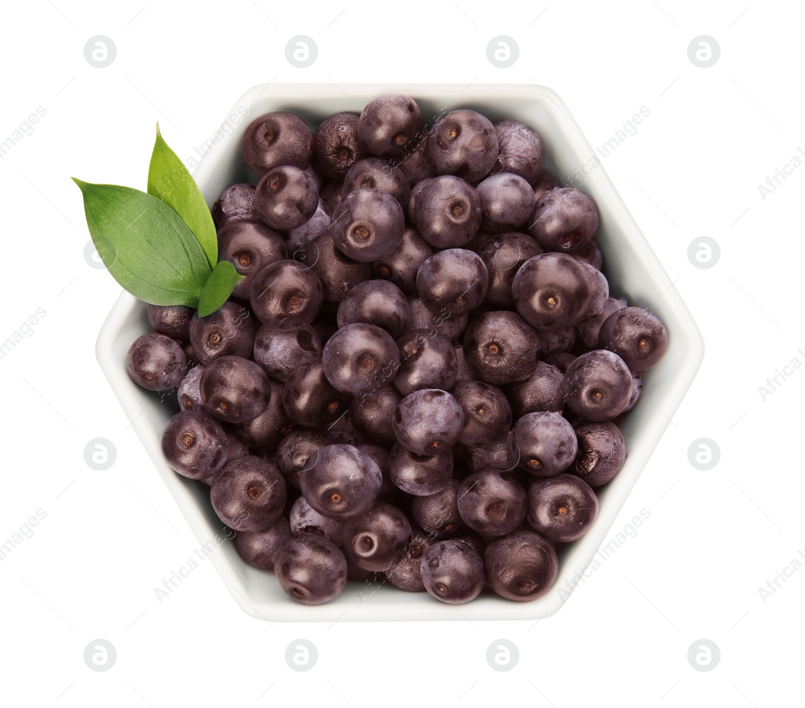 Photo of Bowl with fresh acai berries on white background