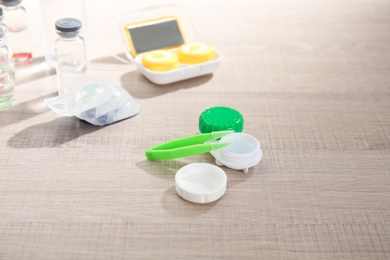 Contact lens accessories on wooden table