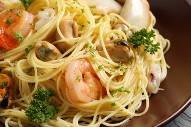 Delicious pasta with sea food in plate, closeup