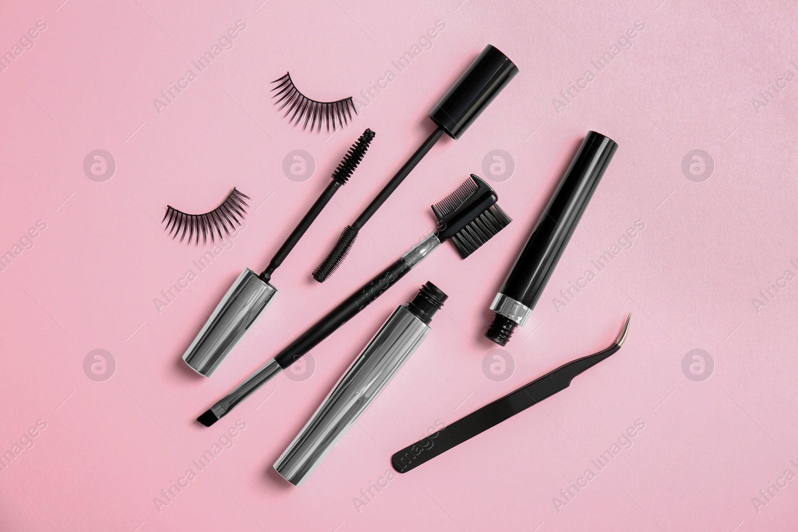 Photo of Composition with false eyelashes on color background