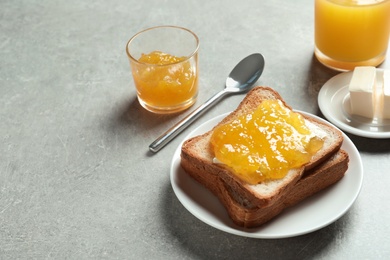 Photo of Toast bread with sweet jam on table