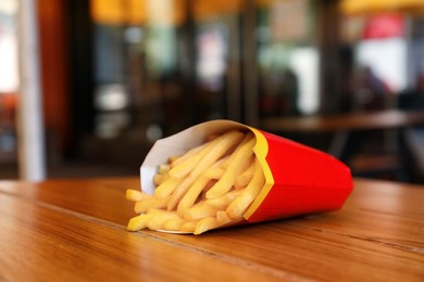 Photo of MYKOLAIV, UKRAINE - AUGUST 11, 2021: Big portion of McDonald's French fries on table in cafe