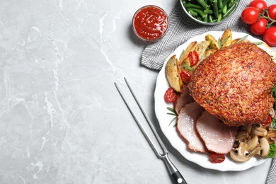 Photo of Homemade delicious ham on grey background, flat lay with space for text. Festive dinner