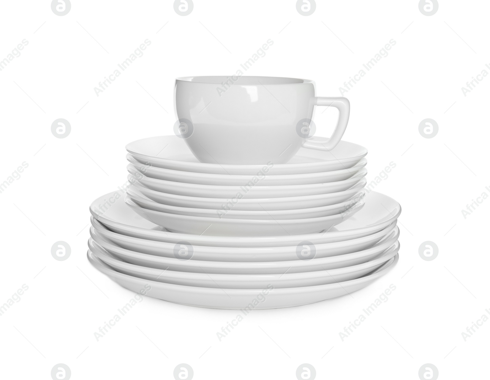 Photo of Stacked plates and cup on white background