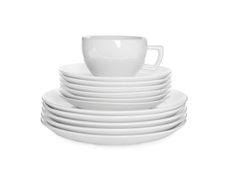 Photo of Stacked plates and cup on white background