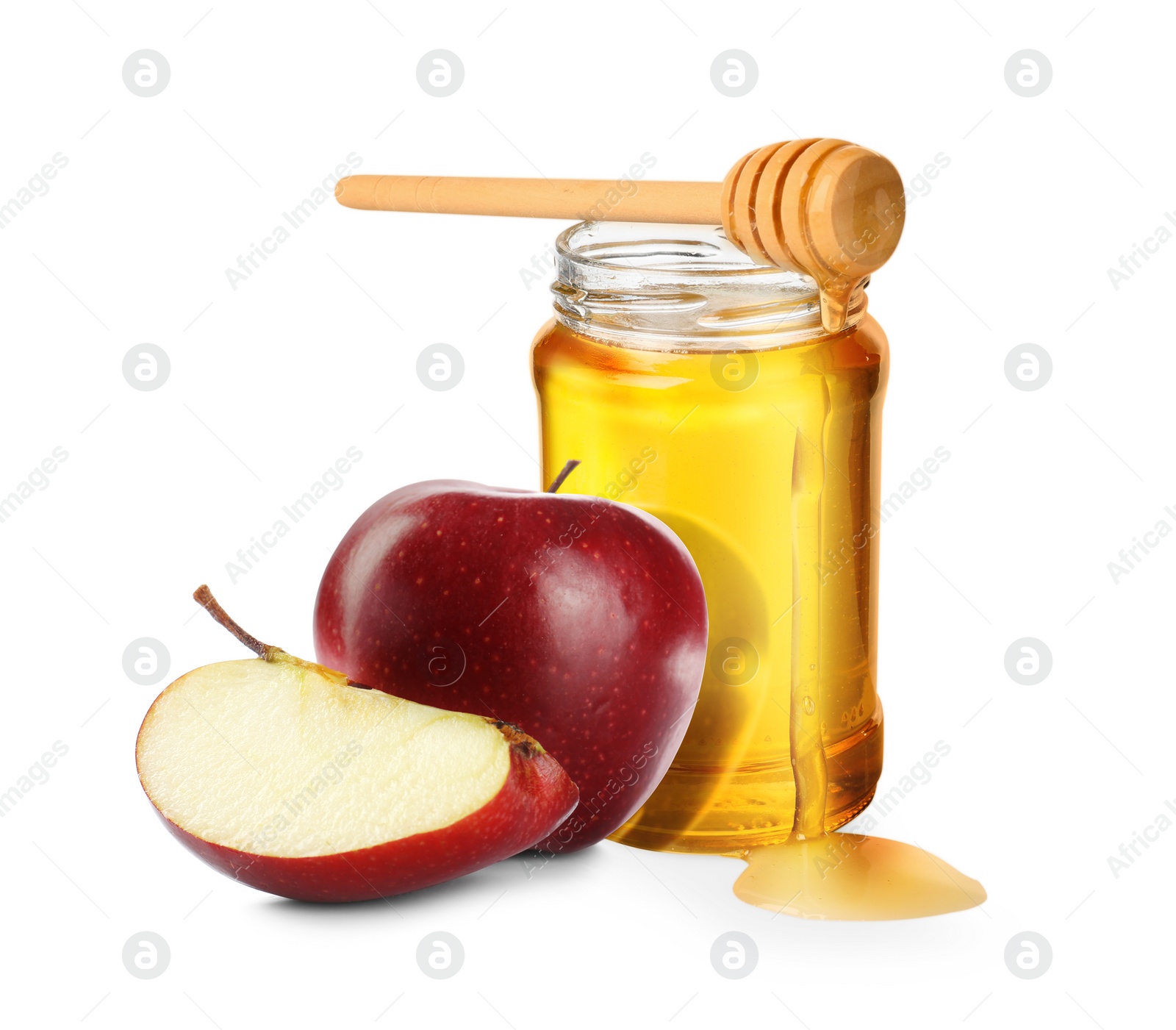 Image of Honey in glass jar, apples and dipper isolated on white