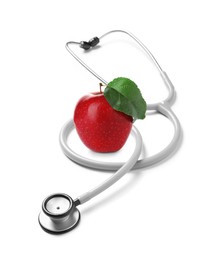 Image of Stethoscope and red apple on white background 