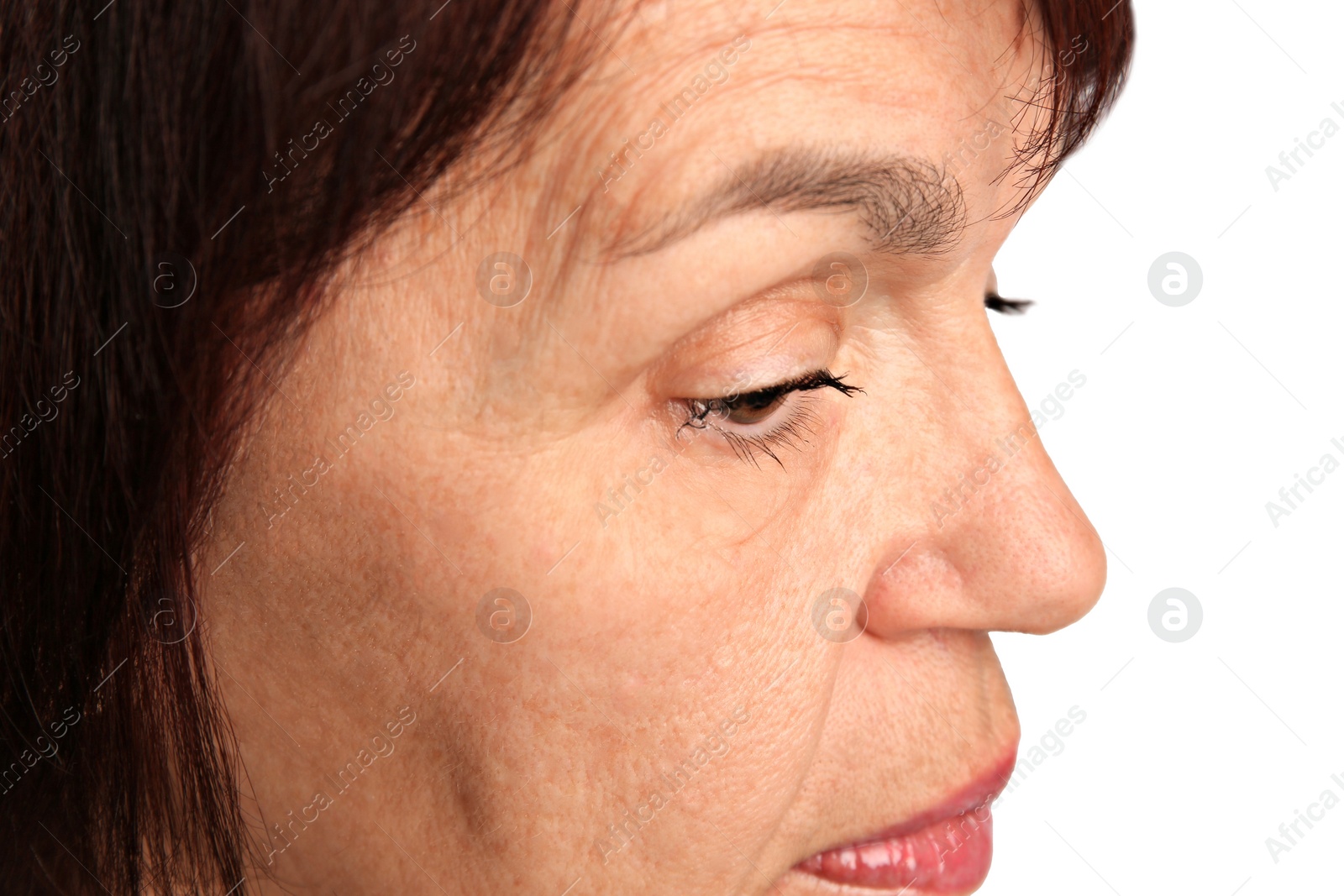 Photo of Skin care. Senior woman on white background, closeup