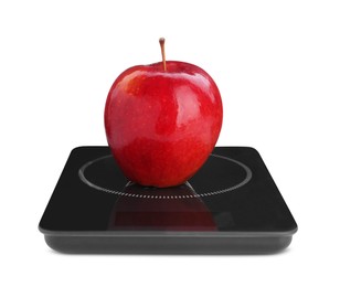 Photo of Modern kitchen scale with fresh red apple isolated on white