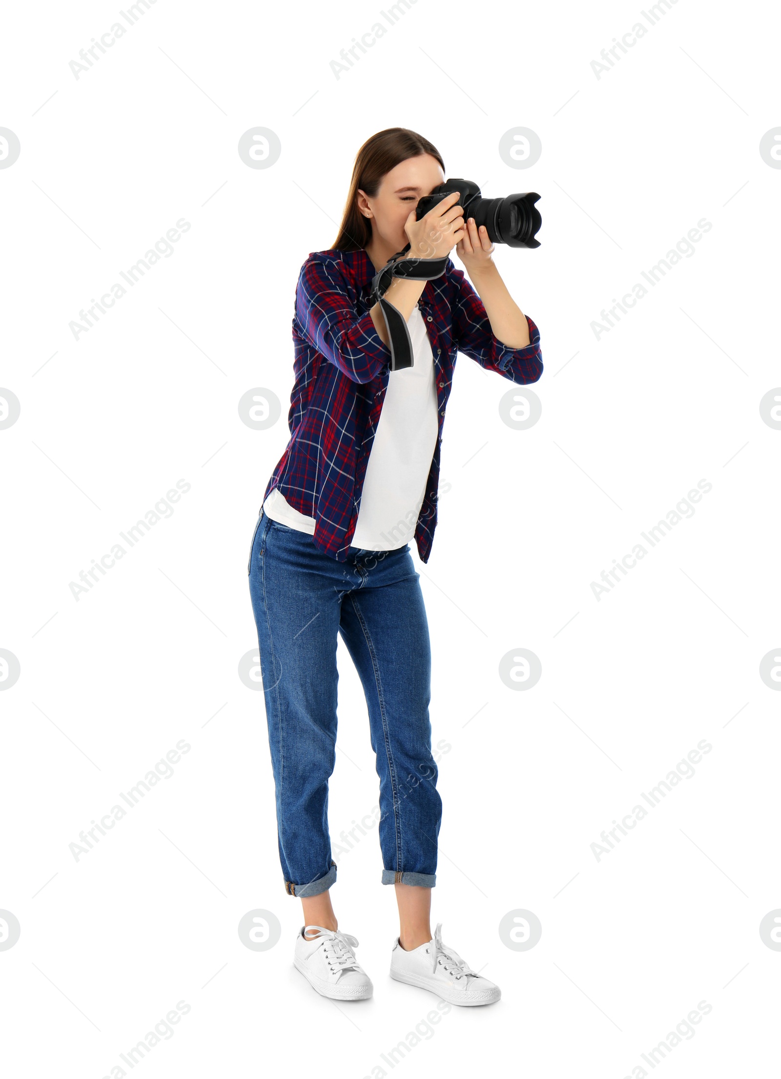 Photo of Professional photographer taking picture on white background