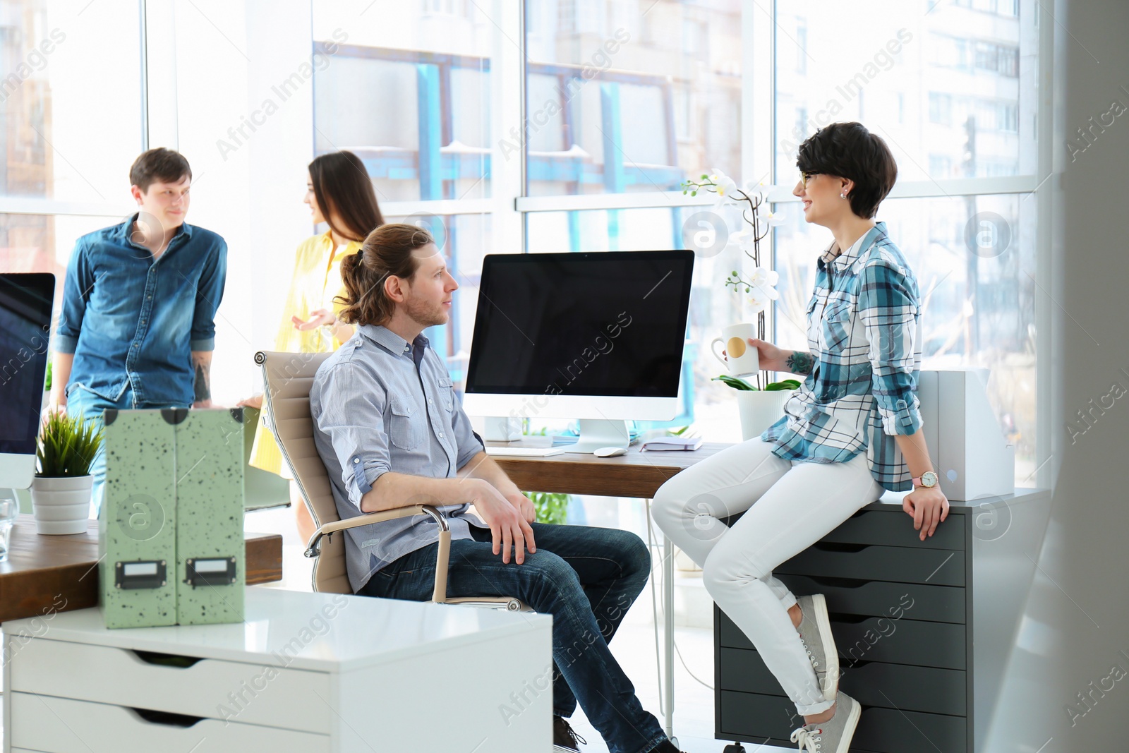 Photo of Young people having business training in office