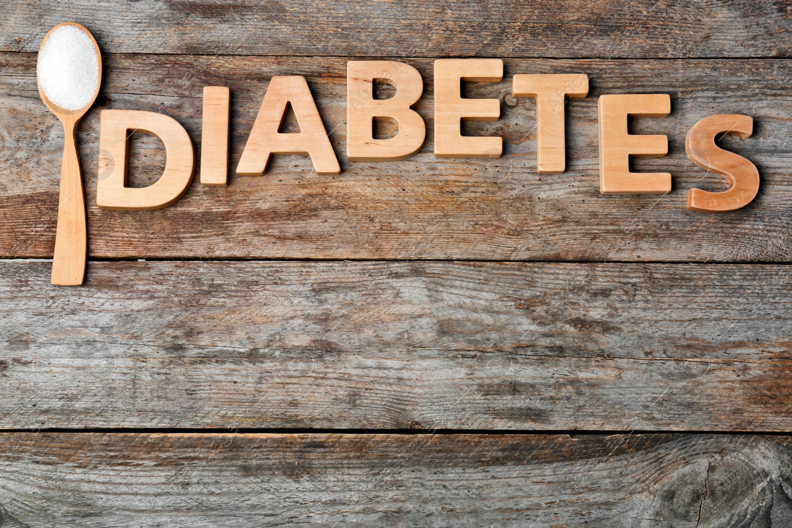 Photo of Flat lay composition with word DIABETES and sugar on wooden background