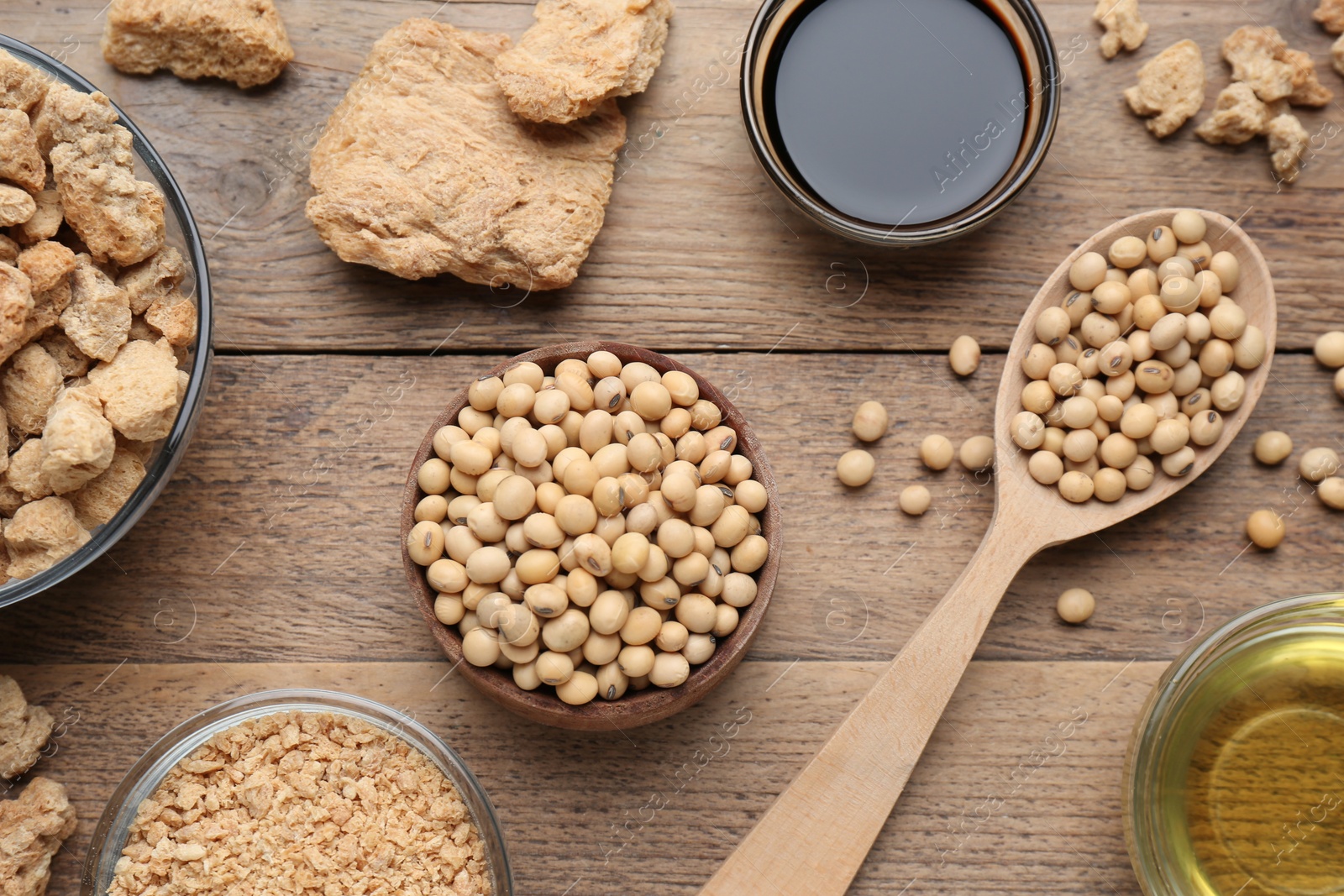 Photo of Different fresh soy products on wooden table, flat lay