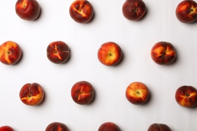 Flat lay composition with sweet juicy peaches on light background