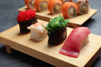Set of delicious sushi on grey table