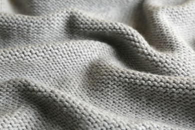 Photo of Beautiful grey knitted fabric as background, closeup