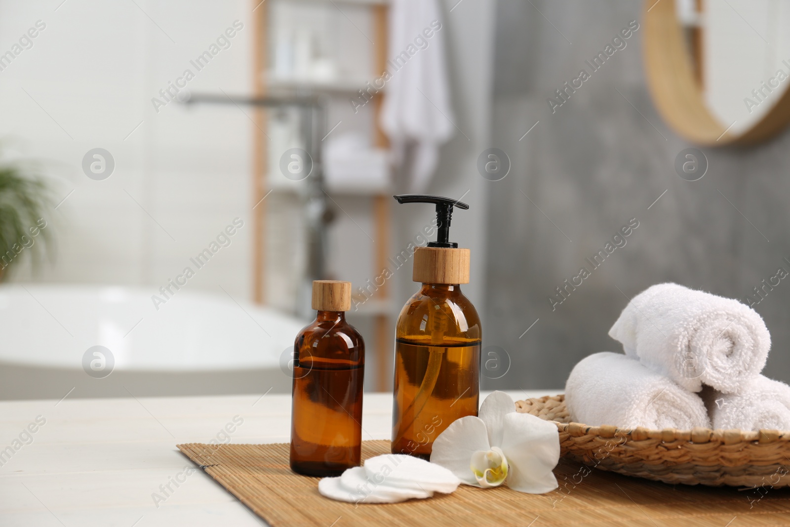 Photo of Composition with spa products on white table in bathroom