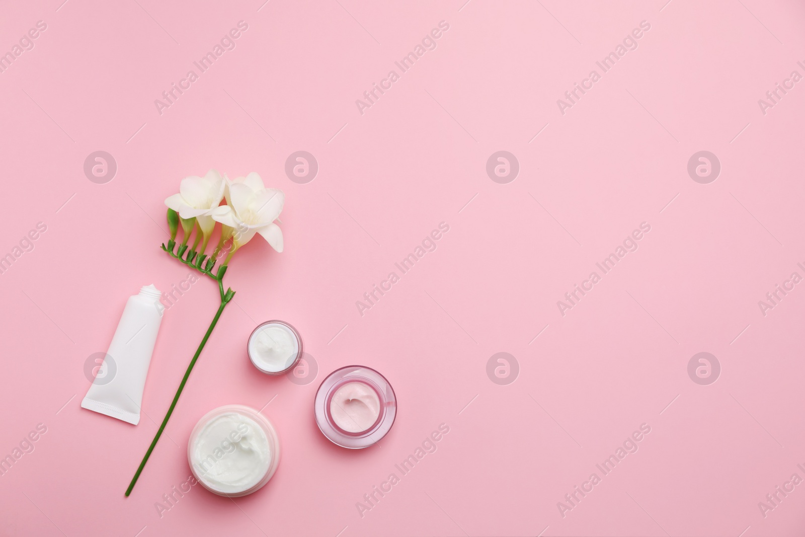 Photo of Flat lay composition with cosmetic products on color background