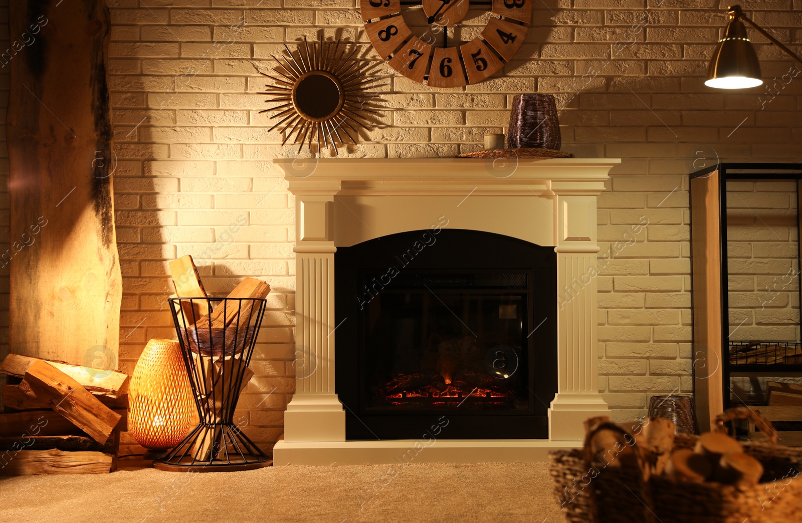 Photo of Fireplace and different decorations in living room. Interior design