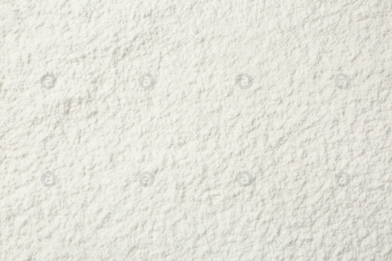 Photo of Pile of organic flour as background, top view